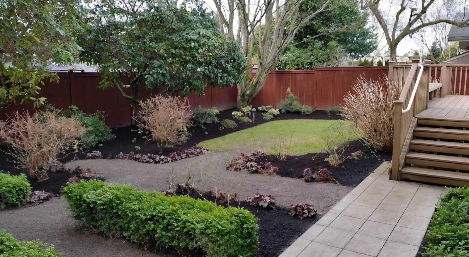 a walkway in a backyard after